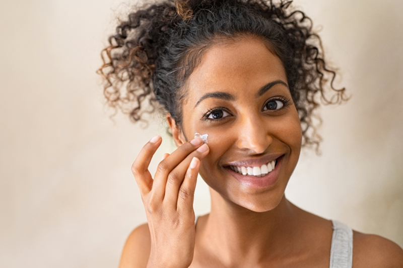 Image of woman applying makeup.