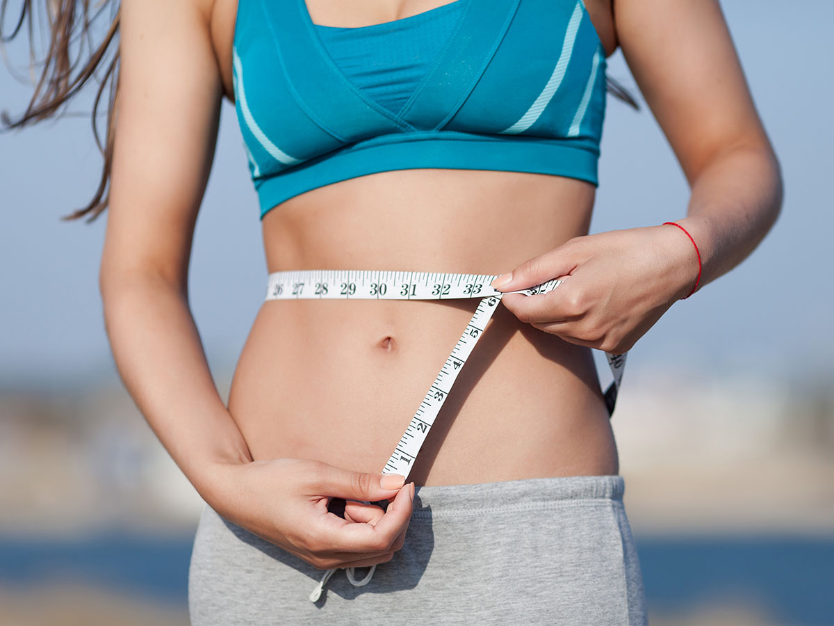 Image of woman feeling great after losing weight