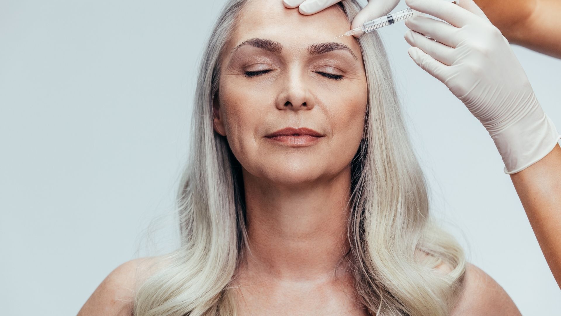 Mature woman getting cosmetic injection