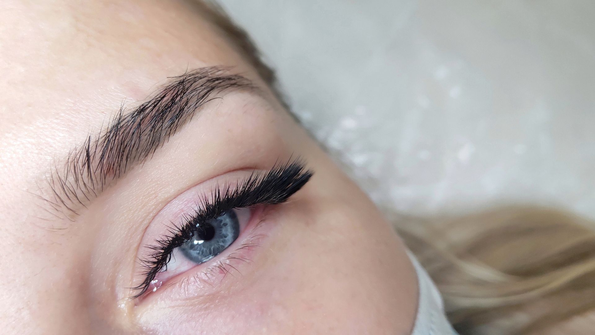 Close-up of a woman's eyelashes and eyebrows.